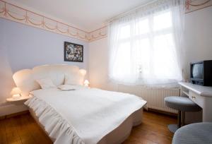 Postel nebo postele na pokoji v ubytování Hotel Reingard