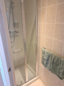 a shower with a glass door in a bathroom at No 27 in Inverness +31 photos