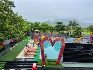 a water park with a pool and a playground at Wayfare SP Resort in Panvel