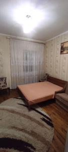 מיטה או מיטות בחדר ב-Holiday Home u Tetiany