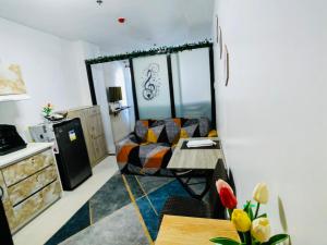 a living room with a couch and a table at Condo at Primavera city next to SM Mall in Cagayan de Oro