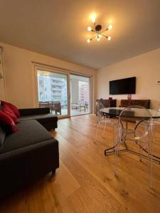 a living room with a couch and a table with chairs at Casa degli Ori by the city in Prato