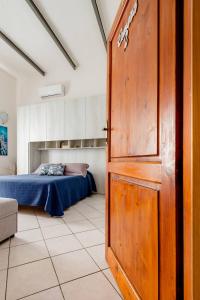 Ένα ή περισσότερα κρεβάτια σε δωμάτιο στο La Casa di Beppe
