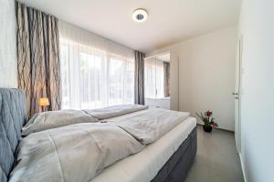Postel nebo postele na pokoji v ubytování Appartement 2 - Dünenblick