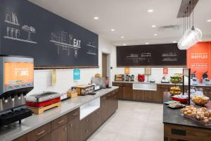 a kitchen with a blackboard in a restaurant at Hampton Inn Hornell in Hornell