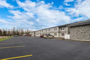 an empty parking lot in front of a building at Quality Inn & Suites in Caribou