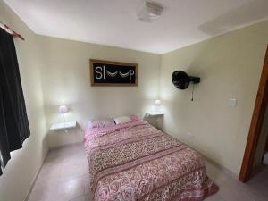 Un pat sau paturi într-o cameră la Complejo La Trinidad