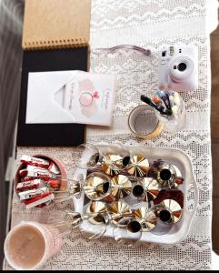 a table with a box of wine and a camera at Poleskie zacisze, domek Bocian, kominek, balia,sauna,wifi in Helenin +73 photos