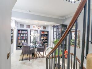 a dining room with a table and chairs at 3 Old Market Place in Harleston