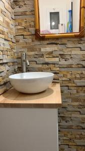 a white sink on a counter in a bathroom at Apartamento Primera Línea de Mar in Platja  d'Aro