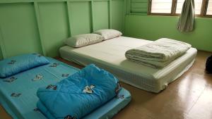 Katil atau katil-katil dalam bilik di Grandpa House 爷爷老家
