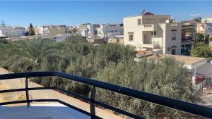 a view of the city from the balcony of a building at Modern Apartment High Standards in Monastir