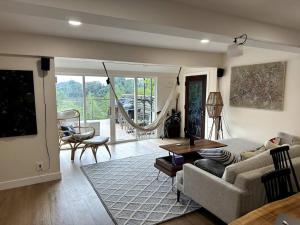 a living room with a couch and a table at Tranquil retreat in Los Gatos in Los Gatos