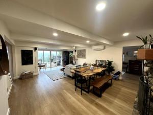 a living room with a table and a couch at Tranquil retreat in Los Gatos in Los Gatos