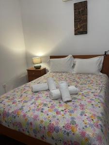 a bedroom with a bed with two pillows on it at LUZ E SAL by Stay in Alentejo in Cavaleiro