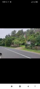 a picture of a road with a flag on the side at Sang Natha Lodge in Tjatur