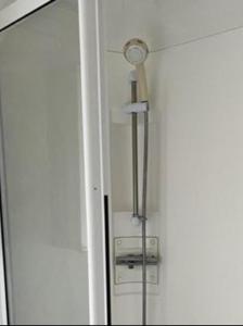 a glass door with a clock on the wall at 3 Bed 2 Bath Static Mobile Home On Fantastic Park in Mablethorpe