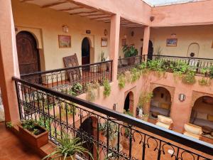 a balcony of a building with plants on it at Ecolodge Atlas Kasbah in Agadir