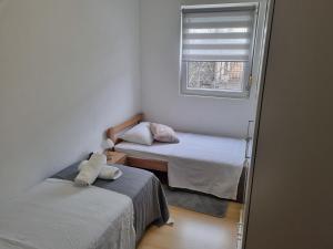 Posteľ alebo postele v izbe v ubytovaní Apartman Batarić