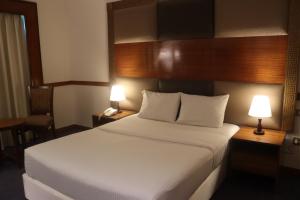 Voodi või voodid majutusasutuse GSS Avenue Hotel Ex Delmon Hotel toas