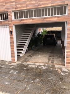 a garage with a car parked inside of it at Temporada Cabo Frio in Cabo Frio