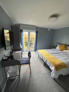 Postel nebo postele na pokoji v ubytování Lynge kro & Hotel