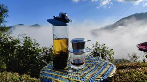 a bottle of oil sitting on top of a table at Tavan View Homestay in Sapa