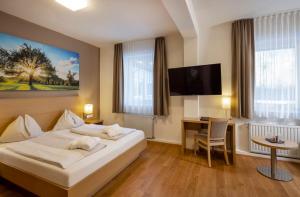 מיטה או מיטות בחדר ב-Vital-Hotel-Styria