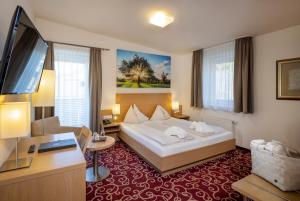 מיטה או מיטות בחדר ב-Vital-Hotel-Styria