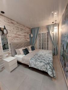Posteľ alebo postele v izbe v ubytovaní ORLANDO LUXURY APARTAMENT