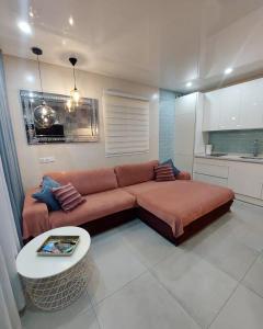 a living room with a couch and a table at ORLANDO LUXURY APARTAMENT in Adeje