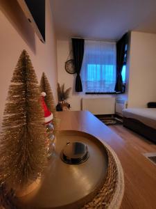 a living room with a christmas tree on a table at Eko FIS Snowscape 601 in Šišava