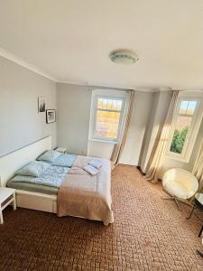 En eller flere senge i et værelse på Willa Pod Wieżami