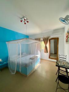 Villa Saraba tesisinde bir odada yatak veya yataklar