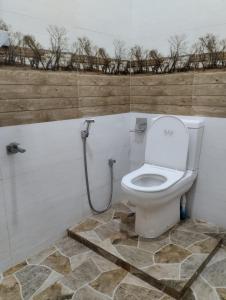 a bathroom with a white toilet in a room at Dream Villa in Matara