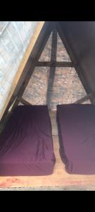 two pillows on a mattress in a tent at Camping Toninhas in Ubatuba