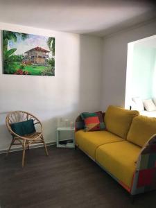 Khu vực ghế ngồi tại Appartement face à l'ilet Gosier