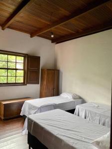 Ένα ή περισσότερα κρεβάτια σε δωμάτιο στο Nina Guest House