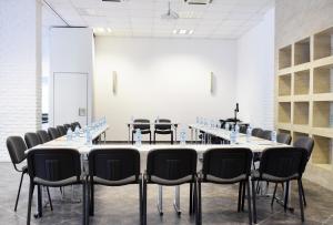 a large conference room with a long table and chairs at Oasis Resort Lozenets in Lozenets