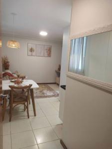a kitchen and dining room with a table and a table and a dining room at Apartamento Aconchegante in Brasília