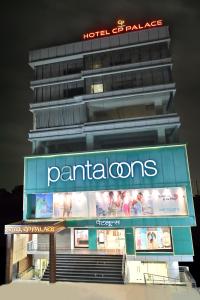 a building with a sign on top of it at Hotel CP Palace in Patna