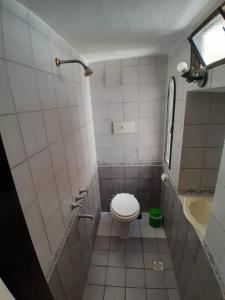 a small bathroom with a toilet and a sink at Meraki Classic in Villa Carlos Paz