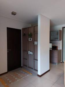 a room with a room with a door and a tv at GALA Dptos. Temp. Condominios del Alto in Rosario