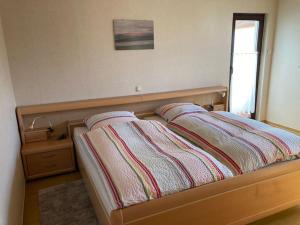 Postel nebo postele na pokoji v ubytování Ferienwohnung für bis zu 4 Personen