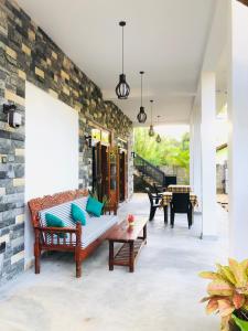 a living room with a couch and a table at Simplex Sea Place in Tangalle