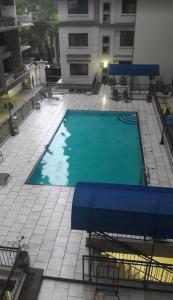 an empty swimming pool on top of a building at MJ Hosting in Dar es Salaam