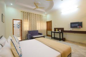 Posteľ alebo postele v izbe v ubytovaní Sudarshan Homestay