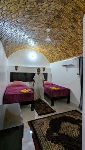 Voodi või voodid majutusasutuse Ajwa Guest House toas