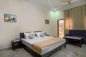 Ένα ή περισσότερα κρεβάτια σε δωμάτιο στο Sudarshan Homestay