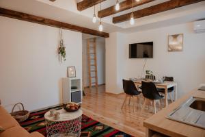 a living room with a kitchen and a table and chairs at Artiesta in Sofia